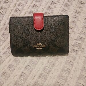 Coach Dark Brown Compact Wallet with Red Snap Strap